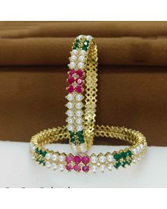 Designer Fresh water Pearl Gold Plated Real Pearl Bangles With Ruby Emerald Stone Work.