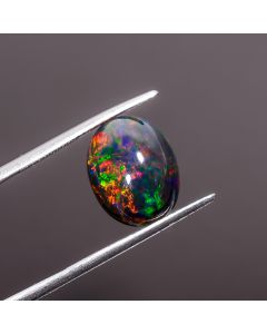 Dazzling Top Grade Quality 100% Natural Multi Fire Black  Ethiopian Opal Oval Shape Cabochon Gemstone For Making Jewelry 13X10X6 mm 3.85 Ct. 