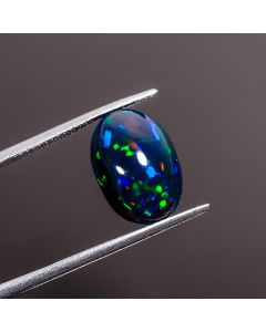 Fantastic Top Grade Quality 100% Natural Multi Fire Black Ethiopian Opal Oval Shape Cabochon Gemstone For Making Jewelry 14X10X7 mm 4.7 Ct.