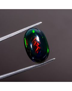 Immaculate Top Grade Quality 100% Natural Multi Fire Black Ethiopian Opal Oval Shape Cabochon Gemstone For Making Jewelry 16X11X6 mm 6.1 Ct. 